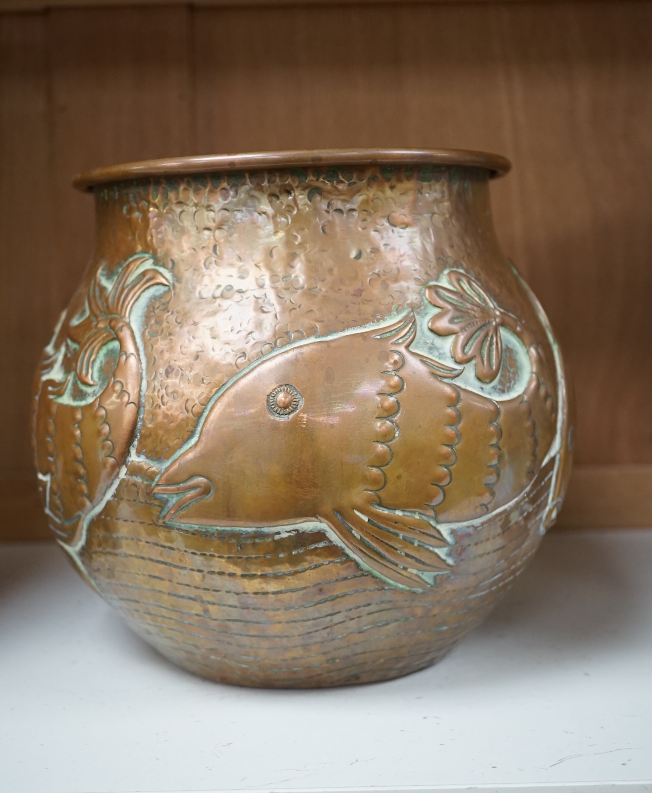 A Newlyn Arts & Crafts jardiniere by John Pearson, decorated with four different fish, signed and numbered 2473. Condition - minor dents, essentially good